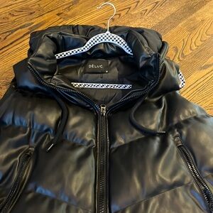 Gently used black leather puffy vest